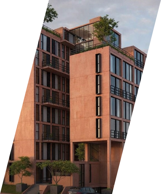 Edificio residencial con balcones y terrazas arboladas